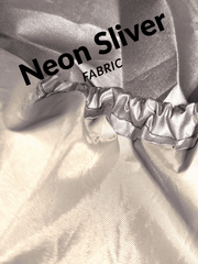 Neon silver fabric with text overlay on a textured background